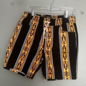 Black and Gold Board Shorts with Bold Design
